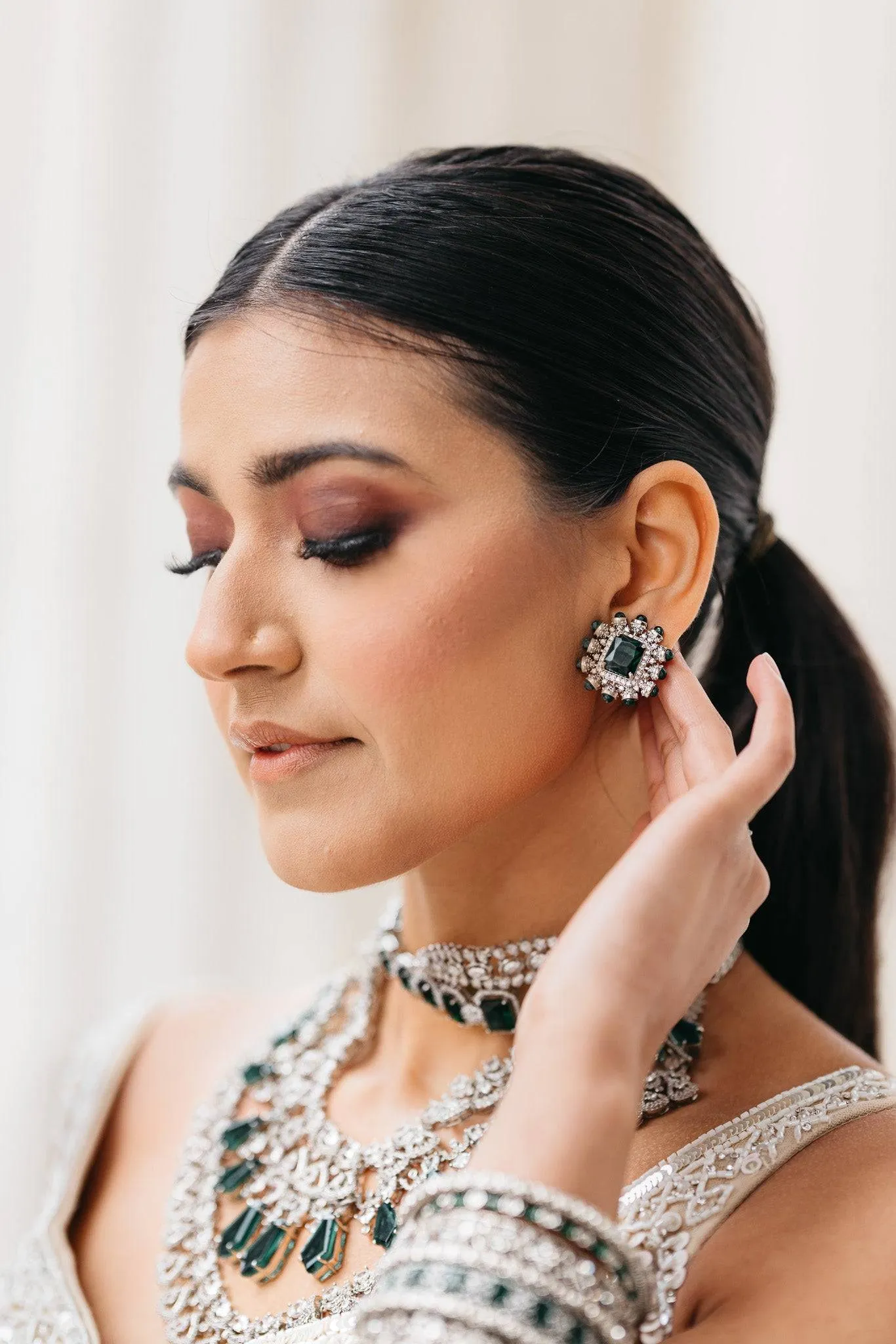 Ashma - Multilayer Rhodium Plated Silver Finish & Emerald Green Bridal Set