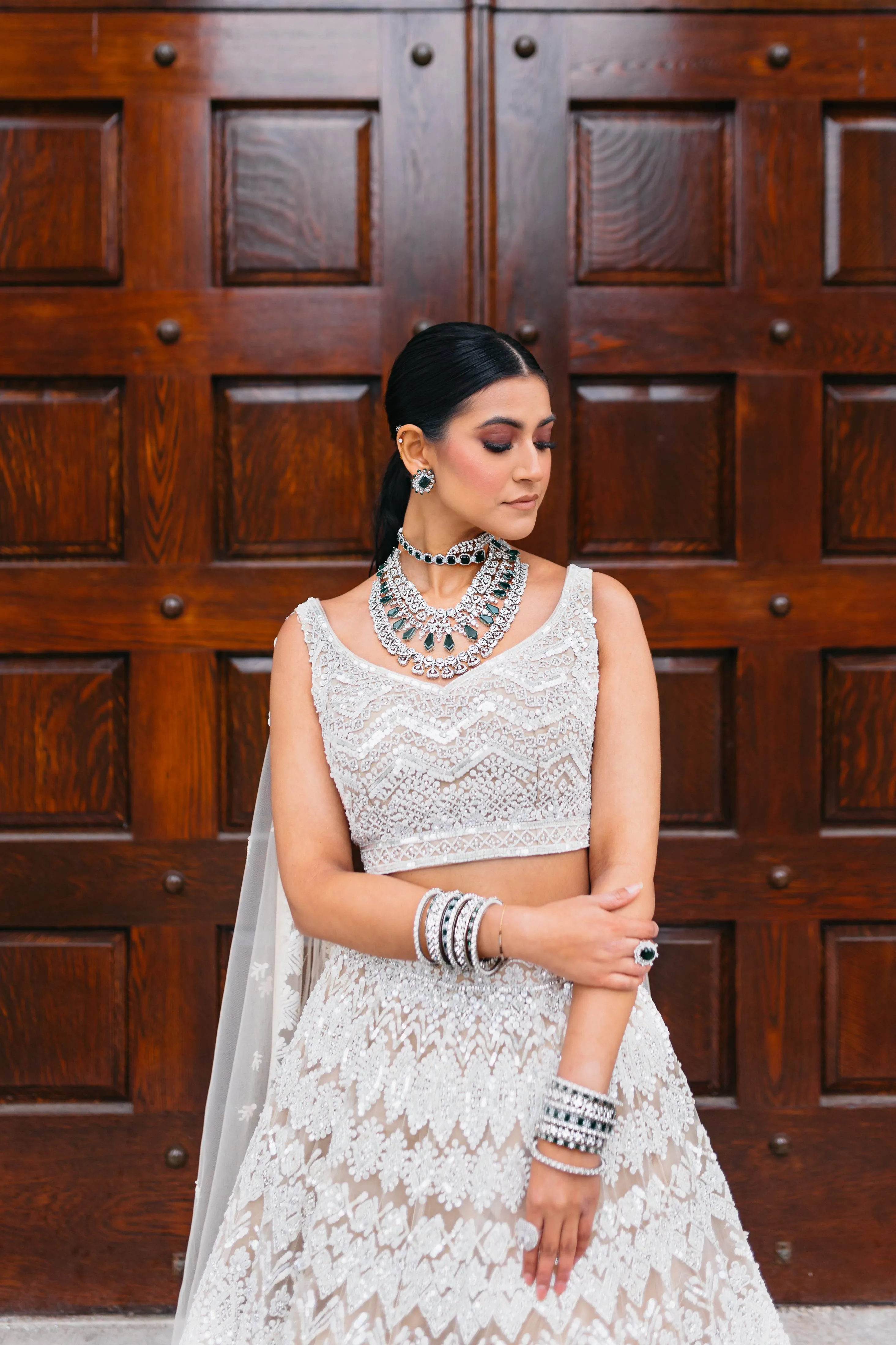 Ashma - Multilayer Rhodium Plated Silver Finish & Emerald Green Bridal Set